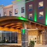 a large hotel with a lit up entrance. houston live surveillance